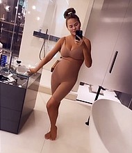 Chrissy Teigen defends Kim Kardashian's maternity shapewear line in Instagram story video./Credit:	Chrissy Teigen/Instagram