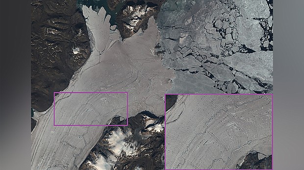 A satellite image from July 31 2019 showing pools and rivers of water on the surface of Greenland's Nioghalvfjerdsfjorden glacier./Credit:	EU Copernicus Sentinel/Geological Survey of Denmark and Greenland
