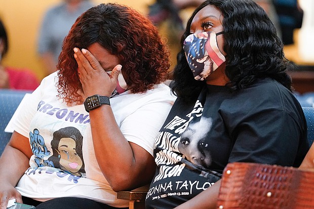 Tamika Palmer, the mother of Breonna Taylor, weeps during a news conference Tuesday announcing a $12 million civil settlement between the estate of Breonna Taylor and the City of Lousiville in Kentucky.