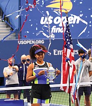 Naomi Osaka of Japan celebrates winning against Victoria Azarenka of Belarus in the 2020 women’s singles U.S. Open tennis tournament last Saturday.