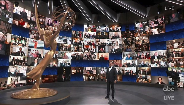 Host Jimmy Kimmel appears with a screen filled with nominees during the 72nd Emmy Awards broadcast. (The Television Academy and ABC Entertainment via AP)/Credit: The Television Academy and ABC Entertainment via AP