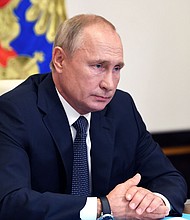 The CIA assessed in August that Russian President Vladimir Putin and his top aides "are aware of and probably directing Russia's influence operations" aimed at undermining Democratic presidential candidate Joe Biden in the 2020 election, according to a new report in The Washington Post./Credit: Alexey Nikolsky/Sputnik/AFP/Getty Image