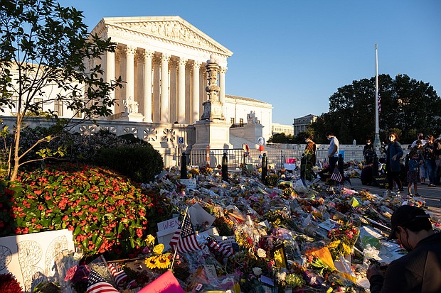 Flowers and notes are placed outside of the Supreme Court to honor Supreme Court Justice Ruth Bader Ginsburg, on Sunday, September 20./Credit: Heather Fulbright/CNN