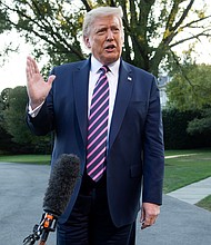 President Donald Trump hoped to make his reelection campaign about the soaring economy at the start of 2020, but the coronavirus pandemic and Trump's response to it have largely defined what Americans are hearing about the presidential campaign./Credit:	Saul Loeb/AFP/Getty Images