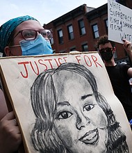 Holding a picture of Breonna Taylor, the 26-year-old woman, was fatally shot by Louisville Metro Police Department as protesters march in downtown Brooklyn over the killing of George Floyd by a Minneapolis Police officer on June 05, 2020 in New York City./Credit: Spencer Platt/Getty Images North America/Getty Images
