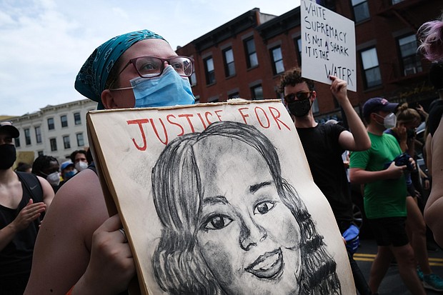 Holding a picture of Breonna Taylor, the 26-year-old woman, was fatally shot by Louisville Metro Police Department as protesters march in downtown Brooklyn over the killing of George Floyd by a Minneapolis Police officer on June 05, 2020 in New York City./Credit: Spencer Platt/Getty Images North America/Getty Images