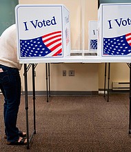 Voters cast their ballots for the 2020 election at an early, in-person voting location in Arlington, Virginia, on September 18, 2020./Credit:	Andrew Caballero-Reynolds/AFP/Getty Images