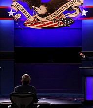 President Trump interrupts as his Democratic presidential opponent Joe Biden makes a point during Tuesday’s debate held on the campus of the Cleveland Clinic at Case Western Reserve University in Cleveland.