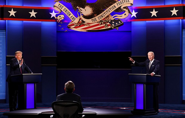 President Trump interrupts as his Democratic presidential opponent Joe Biden makes a point during Tuesday’s debate held on the campus of the Cleveland Clinic at Case Western Reserve University in Cleveland.