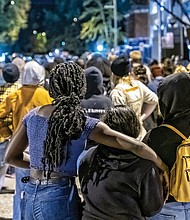 Local demonstrators marched from the area around the Lee statue on Monument Avenue, dubbed Marcus David Peters Circle, to Richmond Police Headquarters.