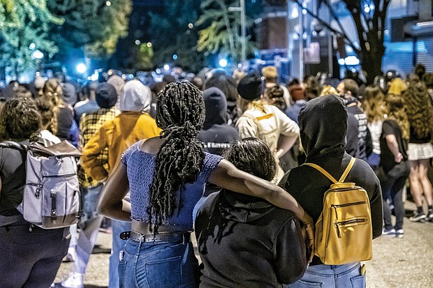 Local demonstrators marched from the area around the Lee statue on Monument Avenue, dubbed Marcus David Peters Circle, to Richmond Police Headquarters.