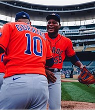 Pitcher Framber Valdez shares a moment with first baseman Yuli Gurriel after the win on Tuesday. Photo Credit/Houston Astros