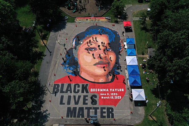 In an aerial view from a drone, a large-scale ground mural depicting Breonna Taylor with the text 'Black Lives Matter' is seen being painted at Chambers Park on July 5, 2020 in Annapolis, Maryland.
Credit:	Patrick Smith/Getty Images North America/Getty Images