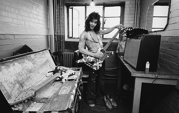 Eddie Van Halen  poses backstage at Lewisham Odeon in London in 1978.
Credit:	Fin Costello/Redferns/Getty Images