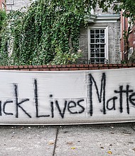 A sign of support or a statement? This homemade “Black Lives Matter” banner was spotted on a brick wall in front of a Monument Avenue residence near Allen Avenue, the intersection where the huge statue to Confederate Gen. Robert E. Lee stands on a traffic circle. The area around the statue has been the epicenter of protests over racial injustice and police brutality since May. Signs like this one and logos with BLM have become commonplace on businesses and other buildings in and near Downtown and the circle following an early spate of window-smashing, fires and looting. The signs often were posted as plea for anyone bent on destruction to spare a structure.