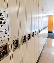 Schools have changed layouts and procedures to try to keep students and staff apart and healthy./Credit:	Mark Lennihan/AP