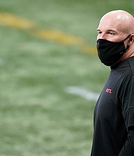 Atlanta Falcons head coach Dan Quinn walks the turf before the first half of the game against the Carolina Panthers on Sunday in Atlanta.
Credit:	Brynn Anderson/AP