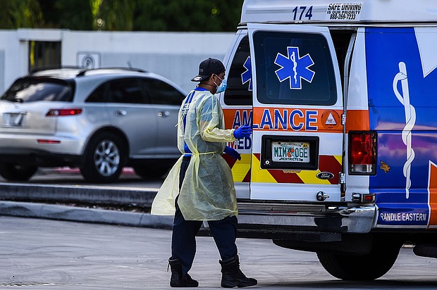 A medic prepares to transfer a patient on a stretcher from an ambulance outside of Emergency at Coral Gables Hospital where Coronavirus patients are treated in Coral Gables near Miami, on July 30, 2020.
Credit:	CHANDAN KHANNA/AFP/Getty Images