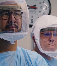 Medical personnel shown wearing face shields in 'Totally Under Control.'
Credit:	Courtesy of Neon