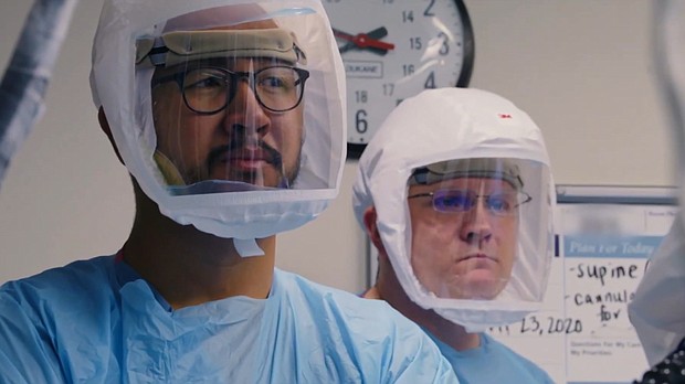 Medical personnel shown wearing face shields in 'Totally Under Control.'
Credit:	Courtesy of Neon