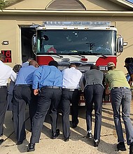 City leaders and community members take part in a “Push In” ceremony to put a new fire engine in service at Fire Station 16. Location: 3901 Cham- berlayne Ave. Among the participants at the Oct. 9 event are Mayor Levar M. Stoney and Richmond Fire Chief Melvin Carter. Four other stations around the city also are planning similar ceremonies when their new trucks arrive.