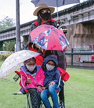 Sydney Woodson, 6, left, and her brother, Kailin Woodson, 7, attend the 18th Annual Gabriel Gathering
last Saturday in Shockoe bottom commemorating the rebellion of Gabriel Prosser, an enslaved blacksmith in Henrico County in 1800. the commemoration, presented by the Sacred Ground Historical Reclamation Project, was held at the site of a planned memorial park to the enslaved. the youngsters were attending the event with their grandmother, Lenora White.