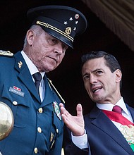 Former Mexican President Enrique Pena Nieto and former Defense Secretary Salvador Cienfuegos Zepeda watch the annual military parade at  Zocalo main square, in Mexico City, Mexico. Zepeda was detained by US authorities at the Los Angeles International airport.
Credit:	Anadolu Agency/Anadolu/Getty Images