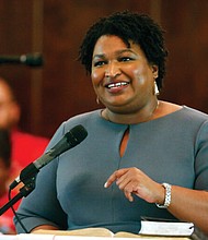 Former Georgia gubernatorial candidate and state Rep. Stacey Abrams speaks on March 1 to the congregation at Brown Chapel AME Church in Selma, Ala.