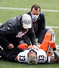 Cleveland Browns' Odell Beckham Jr. (13) stretches before an NFL football game against the Cincinnati Bengals.
Credit:	Michael Conroy/AP