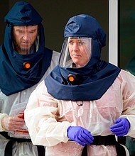 Salt Lake County Health Department public health nurses look on during coronavirus testing outside the Salt Lake County Health Department Friday, Oct. 23, 2020, in Salt Lake City, Utah. (Rick Bowmer/AP)
Credit:	Rick Bowmer/AP