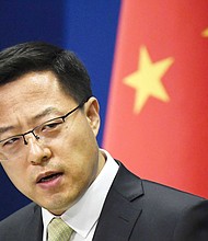 China says it will impose sanctions on Boeing and Lockheed Martin over Taiwan arms sales.
Credit:	Kyodo News via Getty Images