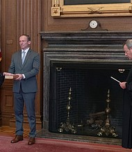 Chief Justice John G. Roberts, Jr., administers the Judicial Oath to Judge Amy Coney Barrett in the East Conference Room, Supreme Court Building. Judge Barrett's husband, Jesse M. Barrett, holds the Bible.
Credit:	Fred Schilling/Collection of the Supreme Court of the United States