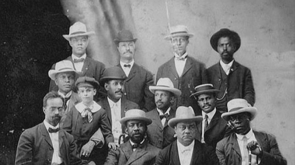 There is a classic photograph of 12 men, seemingly all Black, posing in front of what appears to be either ... There is a classic photograph of 12 men, seemingly all Black, posing in front of what appears to be either ...