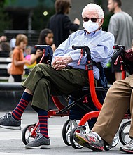 People wear protective face masks in Washington Square Park in New York City during the coronavirus pandemic.
Credit:	Noam Galai/Getty Images