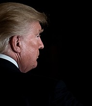 The White House included ending the coronavirus pandemic on a list of the Trump administration's science and technology accomplishments. US President Donald Trump is seen here leaving after a Hispanic Heritage Month event in the East Room of the White House October 6, 2017 in Washington, DC.
Credit:	Brendan Smialowski/AFP/Getty Images