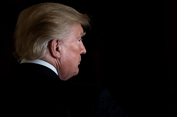 The White House included ending the coronavirus pandemic on a list of the Trump administration's science and technology accomplishments. US President Donald Trump is seen here leaving after a Hispanic Heritage Month event in the East Room of the White House October 6, 2017 in Washington, DC.
Credit:	Brendan Smialowski/AFP/Getty Images