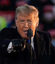 President Donald Trump speaks at a campaign rally on Oct. 27 in West Salem, Wis.
Credit:	Morry Gash/AP