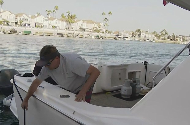 Boater, Trent Mcwhinney, on a boat following the rescue of two children and four adults who were injured in an explosion on November 1, 2020, in Huntington Beach./Credit:	KCAL/KCBS