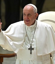 Pope Francis waves during his weekly general audience in the Paul VI hall at the Vatican on October 14, 2020./Credit:	ALBERTO PIZZOLI/AFP/AFP via Getty Images