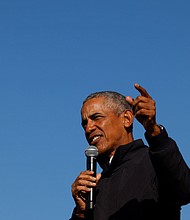 Former U.S. President Barack Obama gestures as he speaks at a democratic U.S. presidential nominee and former Vice President Joe Biden's campaign drive-in, mobilization event in Flint, Michigan on October 31, 2020.
Credit:	Brian Snyder/Reuters