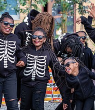 Members of the Diamonds of Essence Dancers have fun as they perform on Halloween during the Black Coalition of Change Justice Rally to Unify and Empower the black Community. The event, held in Church Hill and sponsored by a coalition of groups, had a festival atmosphere with music, dancing, food and vendors.