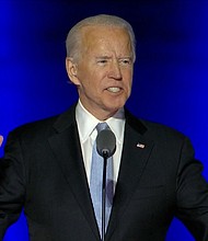 President-elect Joe Biden delivers remarks during his victory speech in Wilmington, Delaware on Nov. 7.
Credit:	POOL