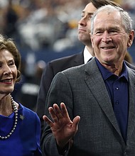 Former President George W. Bush and former First Lady Laura Bush are seen here attending the NFL game between the Dallas Cowboys and the Green Bay Packers at AT&T Stadium.
Credit:	Ronald Martinez/Getty Images