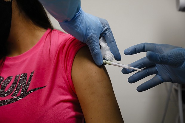 A health worker injects a person during clinical trials for a Covid-19 vaccine at Research Centers of America in Hollywood, Florida on Sept. 9.
Credit:	Eva Marie Uzcategui/Bloomberg/Getty Images