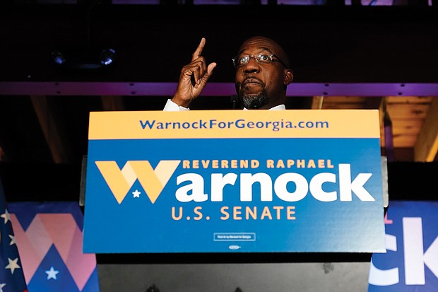 The Rev. Raphael Warnock, a Democratic candidate for the U.S. Senate, speaks Nov. 3 during a rally in Atlanta.