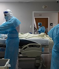 The US reported the most single-day Covid-19 deaths since May and experts say pandemic is accelerating
Credit:	Go Nakamura/Getty Images