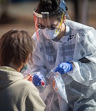 Marissa Gallegos with Medical Teams Northwest takes a swab from a person who was accessing COVID-19 testing at the Lane County Fairgrounds in Eugene, Oregon on October, 8, 2020.
Credit: Andy Nelson/Imagn/USA Today