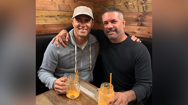 John Shimooka (right) poses for a photo with Kelly Slater.
Credit:	From John Shimooka/Instagram
