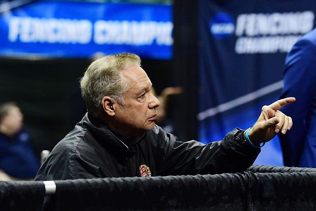 Head coach Peter Brand talks to Veronica Czyzewski of Harvard as she competes against Karolina Cieslar of St. John's in the Saber semi finals during the Division I Women's Fencing Championship held at The Wolstein Center on the Cleveland State University campus on March 24, 2019 in Cleveland, Ohio.
Credit: Jason Miller/NCAA Photos/Getty Images