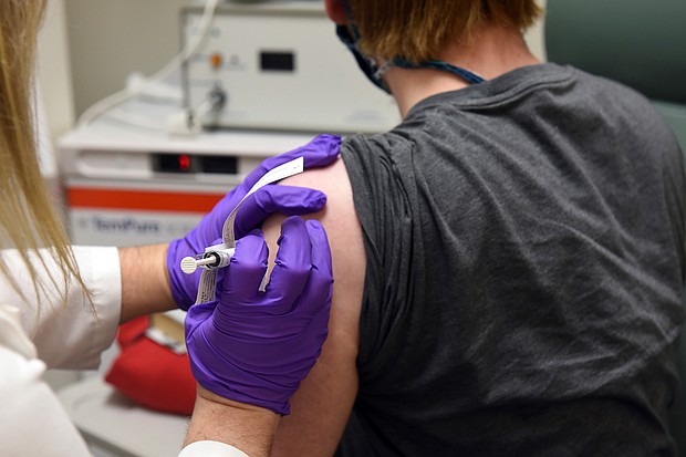 This May 4, 2020, file photo provided by the University of Maryland School of Medicine, shows the first patient enrolled in Pfizer's COVID-19 coronavirus vaccine clinical trial at the University of Maryland School of Medicine in Baltimore.
Credit:	University of Maryland School of Medicine/AP